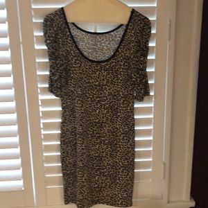 Cheetah dress with rouged sleeves.
